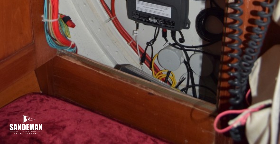 BEHIND ELECTRICAL PANEL