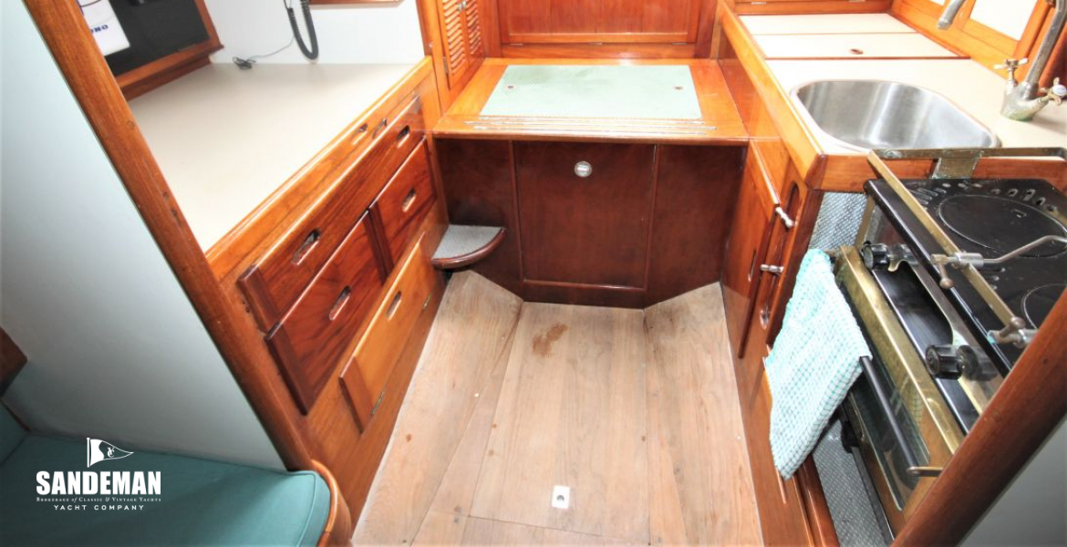 Saloon view aft to nav, engine box and galley