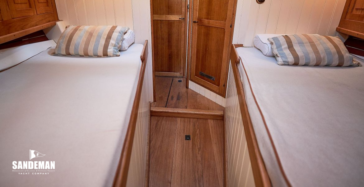 Fore berths view aft to head and saloon doors aft