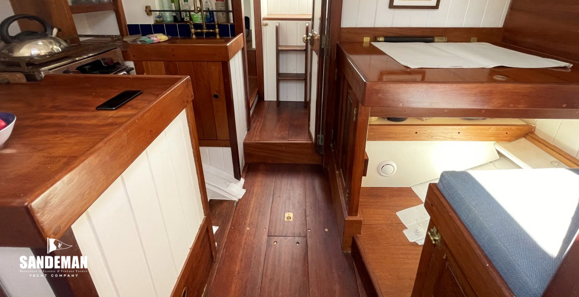 View aft to galley, nav, and companionway landing