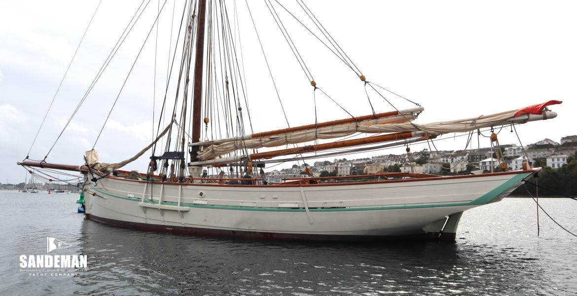 Aft of the beam moored