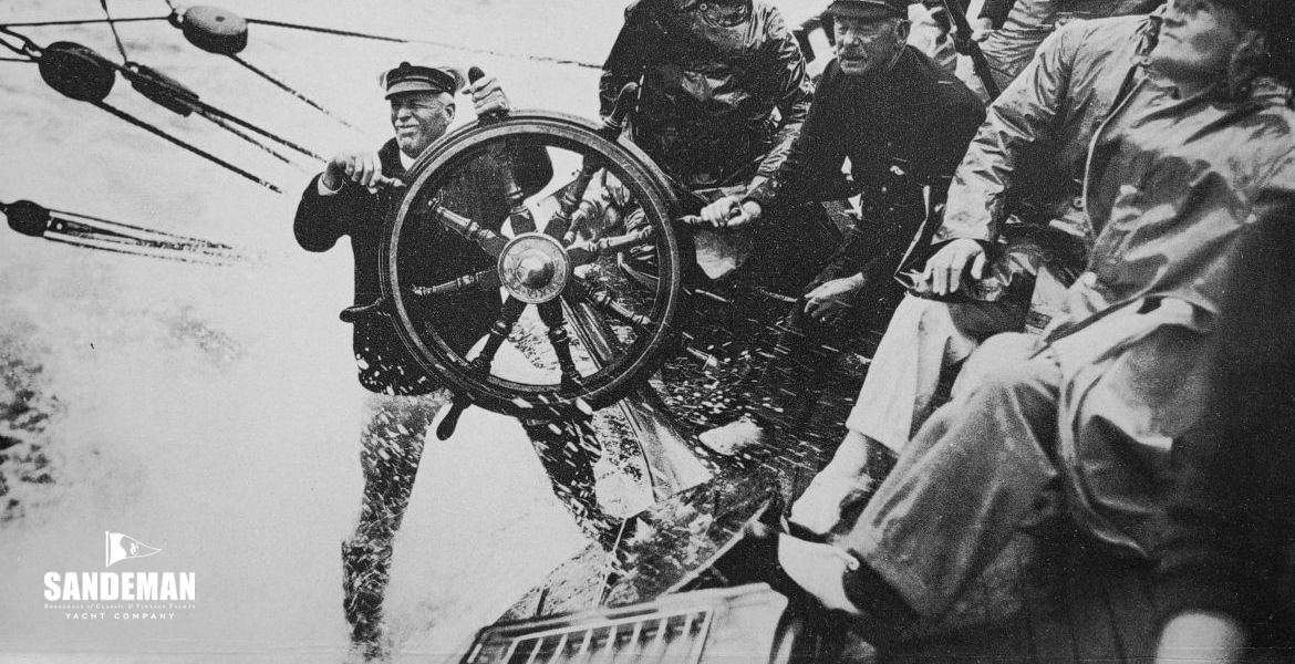 Hunloke (left) at the helm of BRITANNIA with Captain Turner (right)