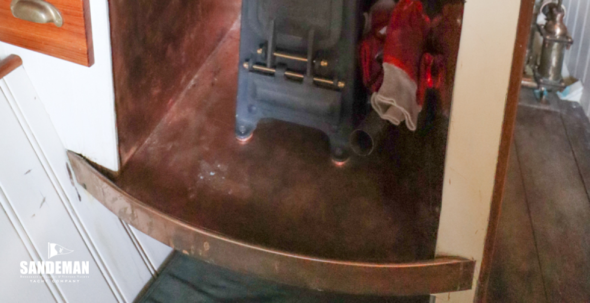 Faversham solid fuel stove; ship's clock