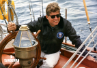 JFK at the helm [PHOTO: Robert Knudsen. White House Photographs. John F. Kennedy Presidential Library and Museum, Boston]