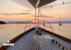 Under the foredeck awning at sunset