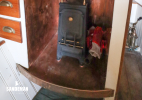 Faversham solid fuel stove; ship's clock
