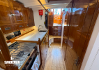 Passage aft, galley to stbd, heads to port